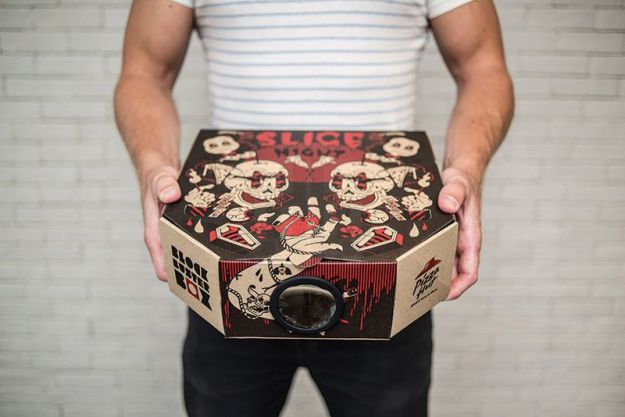 Pizza Hut thinks it can do more than just bring food to your front door. It wants to deliver your entertainment for the evening, too. At least, that's the case in Hong Kong, where the pizza chain is delivering some pizzas in specially-designed boxes that convert into pseudo movie projectors. Designed by Ogilvy Hong Kong, the advertising stunt uses boxes with a perforated, pop-out hole in the side of the box. A very unique pizza table (also called a pizza protector) then serves as the projector's lens. Slip the plastic lens into the hole, and then use the pizza table's legs to prop up your smartphone inside the box. The contraption then blows up your phone's display onto any nearby wall. Even better, there are four different boxes, each of which comes with a separate movie download via a QR code. They're called Slice Night (for horror fans), Anchovy Armageddon (for science-fiction), Hot & Ready (for romance), and Fully Loaded (for an action flick). The box itself is fittingly called the "Blockbuster Box." Of course, you'll need a very dark room to be able to make out anything from the "projector," and even then, the quality will still be pretty piss-poor. That's not to mention the fact that you'll probably get your phone all greasy by sticking it in that pizza box, and that you'll have to try to make out whatever muffled audio makes it through the walls of the pizza box. We're not letting that stop us from trying it out though — we just need to find a way to get to Hong Kong first.