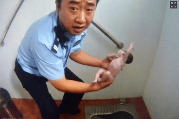 NYDN- A newborn baby girl was found stuffed head-first down the pipe of a Chinese public toilet after passersby heard her screams for help. The terrified tot's mom apparently abandoned the youngster in the Beijing building shortly after giving birth on Sunday afternoon, according to reports. The infant was extracted from the sewer of the squat toilet after cops arrived, reports the Huffington Post. "The baby's head was upside down and the whole body has fallen into the sewer. I could vaguely see the baby's feet from the side," police officer Qian Feng told the People's Daily. She was rushed to hospital, where doctors determined that she had not suffered serious injuries and is expected to make a full recovery.
