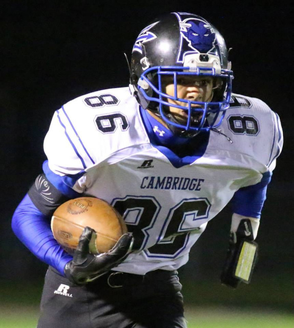 When Kris Silbaugh was 5 years old he plopped down on one knee and taught himself how to tie his own shoes. By the time he turned 9, Silbaugh was blowing past his neighborhood pals and catching deep balls in pickup football games so often that he became the most feared receiver on the block. At 14, in his first year of organized football at Cambridge Springs (Cambridge Springs, Pa.), he was carrying that distinction with him onto the gridiron as a freshman on the varsity squad. All modest feats that immediately upgrade to mind-boggling when you consider that Silbaugh was born without his left hand. “It was just some sort of birth defect,” Silbaugh said. “Nothing was wrong. It has never stopped me. I just don’t let it; never have.” Be clear: Silbaugh isn’t “good for a guy with one hand” he’s downright dominant. Last Friday, Silbaugh became Cambridge Springs’ all-time receiving yards (915) leader when he snagged a 43-yard touchdown catch during a 63-0 win over Saegertown (Saegertown, Pa.). “I knew I was close to it last year, but I had forgotten about it,” Silbaugh said of breaking the previous record of 912 yards from 1998. “I was shocked; one of my coaches told me at halftime and I was just like, ‘Oh wow!’ It definitely makes me feel good that I was able to do that, but I always believe in myself.” Even when it’s uncomfortable. Coming up, Silbaugh always wanted to play football, but, admittedly, let his fear “of what people would say” halt those plans. He internally struggled with the “why me” questions but kept his feelings bottled up. “I never wanted anyone to pity me,” Silbaugh said. “I hate that feeling.” Instead, the pent-up feelings created a football-sized chip smack-dab on his shoulder and by freshman year the desire to suit up outweighed the discomfort. “I knew I wanted to be a receiver, but I didn’t know how everyone would react when I tried out,” Silbaugh said. “Finally, I just kind of went for it. I knew I would have to be better than good. I still remember Coach (Clint) Rauscher, who was the head coach at the time, and he was a little shocked when I said I was a receiver.” Kris Silbaugh said he always feels like he's got something to ptove. (Photo: Jeff Bobin) Kris Silbaugh said he always feels like he’s got something to ptove. (Photo: Jeff Bobin) It didn’t take long for Silbaugh to transition from being the “one-handed player you’ve just gotta see” to being the player you’d better focus on stopping. “It went from the guys being excited to see if he could actually do something to them counting on him to make plays,” said Justin Grubbs, who was an assistant since Silbaugh started playing as a freshman and is now in his first year as head coach at Cambridge Springs. “It’s just amazing to see what he’s able to do. He makes catches that you wouldn’t believe. He’s a guy that defenses have to have a game plan for and he’s just so fast.” How fast? Silbaugh clocks a 4.4-second 40-yard dash; the same range that five-star prospects were in this summer at The Opening Championships, Nike’s football camp for the top high school football players in the country. “I’m pretty confident because of my speed and I just feel like every ball is a catchable ball for me,” said Silbaugh, who also plays volleyball and basketball. “I’ve been getting a few letters from colleges, but I’m just focusing on the season. I just want to help the team in any way that I can.” Plus, Silbaugh’s got yet another record in his sights: All-time receptions leader. Currently, he’s sitting at 38 catches for his career; two this season. The record is 57. “I definitely want all of the records I can get,” Silbaugh said. “It’s crazy that, at first, no one knew me and now I get the best guy in the secondary all the time. I still feel like I have to prove people wrong because there’s always someone in the stands that hasn’t seen me play. I know that people will always be shocked at what I’m able to do because I only have one hand, but my goal is to be known as a dominant player, period.”