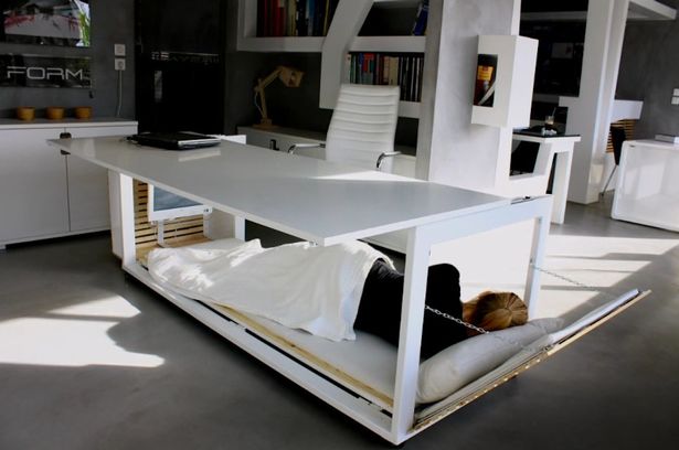 Ever feel like you spend so much time in your office that you might a swell sleep there? Well, now there's a space-saving desk which ingeniously allows you to do just that. But you might not want to tell the boss about it in case you start getting more overtime. A Greek architect has designed the desk which converts to a bed, just the thing for those late-night office sessions. They told Archilovers : "The main concept was to comment on the fact that many times our lives are 'shrinking' in order to fit into the confined space of our office. "Eventually, I realized that each civilization may have a very different perception of things depending on its social context."